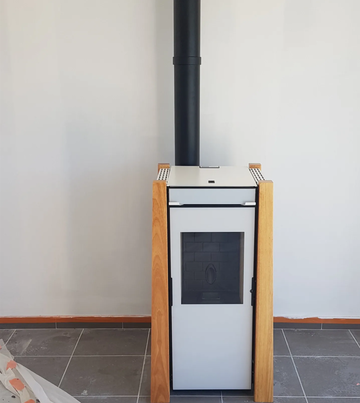 Installation d'un poêle à granulés dans une villa RT2012 vers Le Soler
